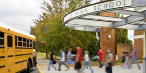 High School Students walk toward a bus